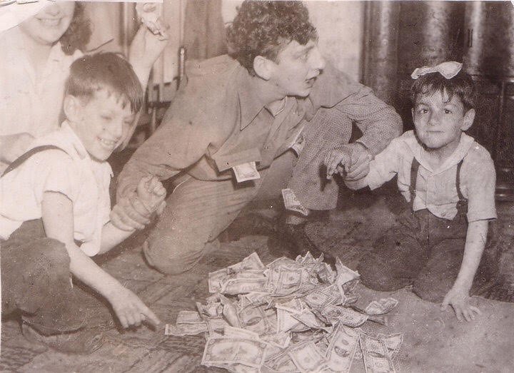 Jerry Rispoli referees an arm-wrestling match over a pile of cash