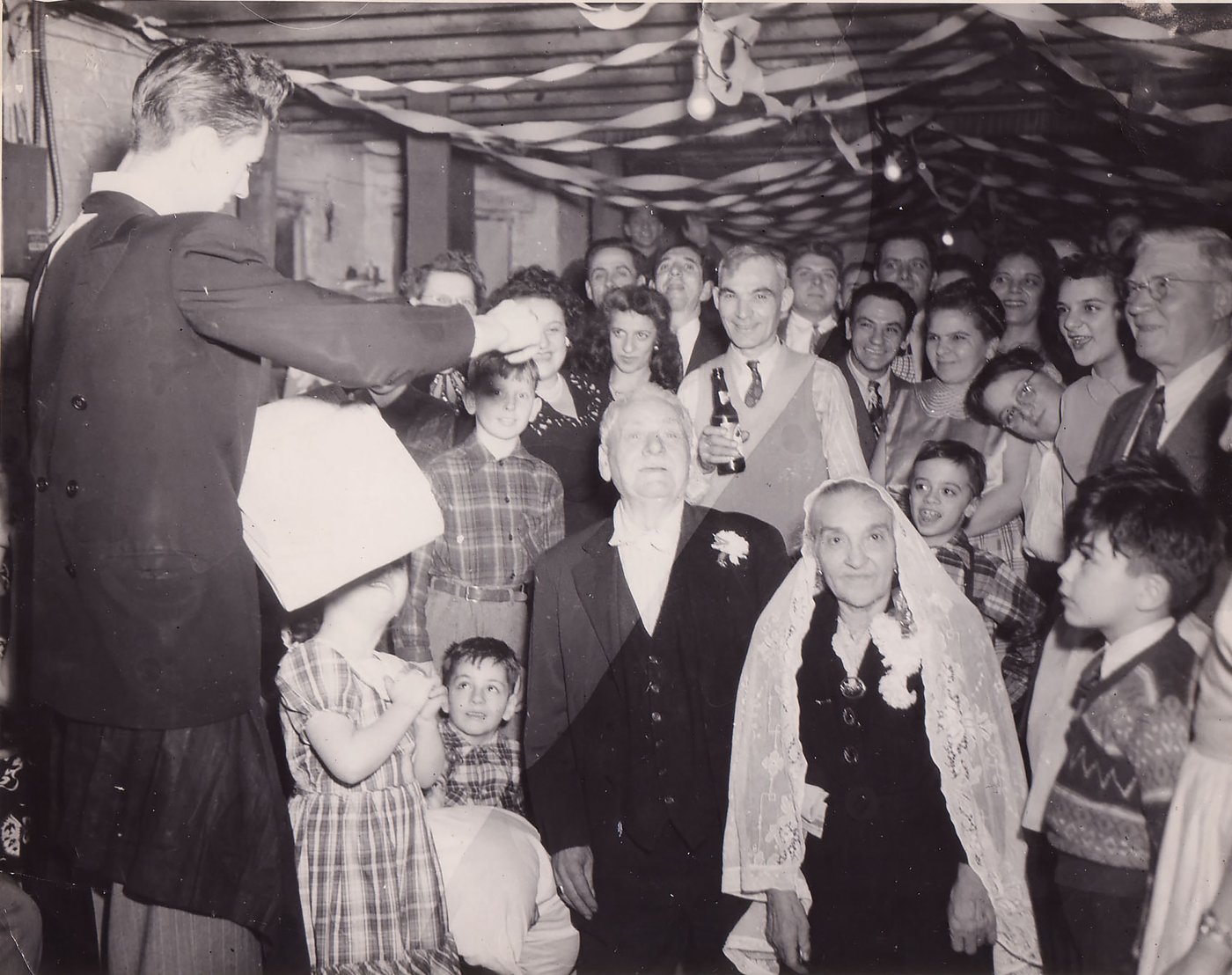 A larger family group photographed at the same golden wedding anniversary celebration
